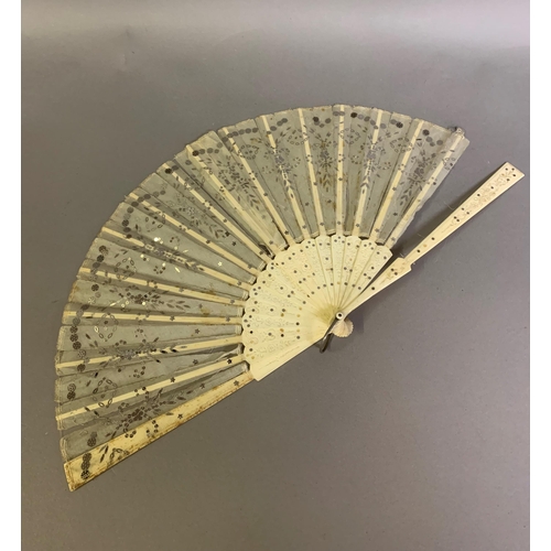 63 - A 19th century bone Jenny Lind fan with elaborately carved gorge, designed with concentric bands of ... 