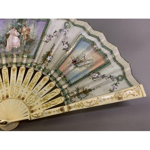 64 - A small bone late 19th century/early 20th century gilded bone fan mounted with the known printed sil... 