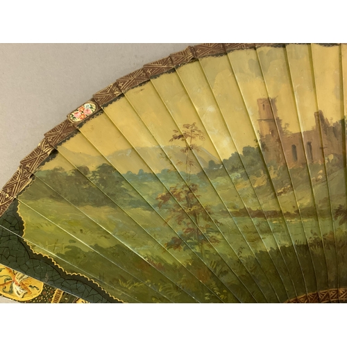 67 - A good 19th century Vernis Martin type brisé fan, bone sticks, almost totally decorated with a merry... 