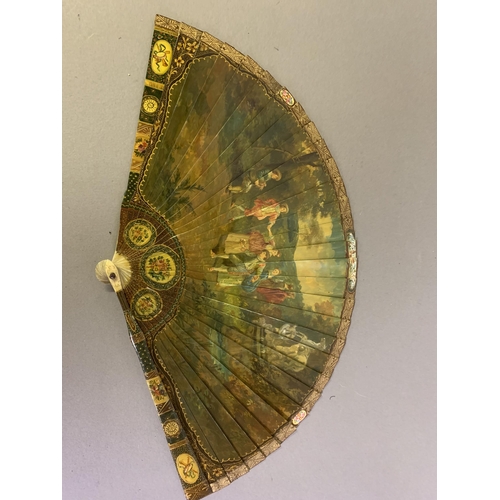 67 - A good 19th century Vernis Martin type brisé fan, bone sticks, almost totally decorated with a merry... 