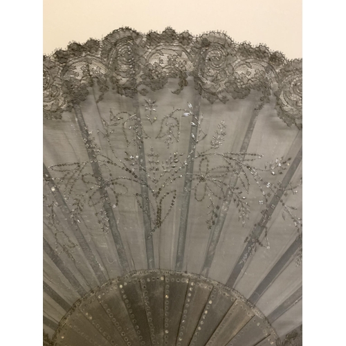 86 - A large Limerick lace fan c 1890’s, the leaf designed with a central harp, the remaining leaf a mean... 