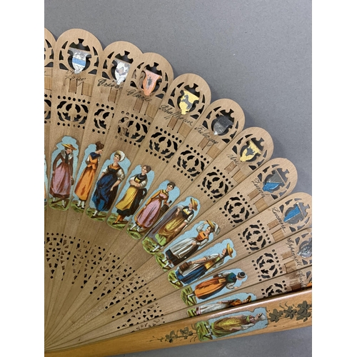 19 - 19th century light wood brisé fan with a transfer print of a winter scene showing impressive buildin... 