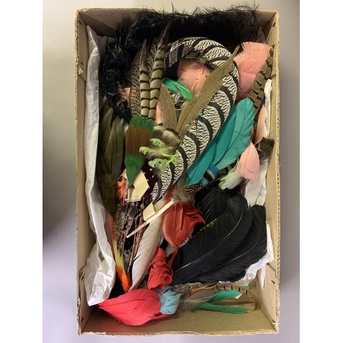 258 - Haberdashery: Four boxes (one being a Harrods hatbox) of millinery and costume feathers, many with t... 