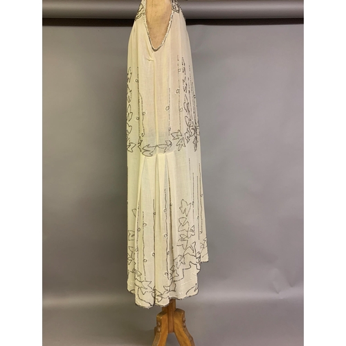 274 - A 1920’s beaded dress, cream cotton embroidered with clear beads, labelled “Made in France”, approx.... 