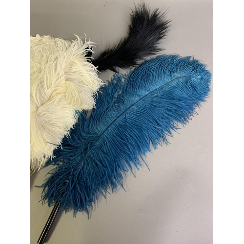 108B - A cream ostrich feather fan mounted on white mother pf pearl with a hint of pink; together with a si... 