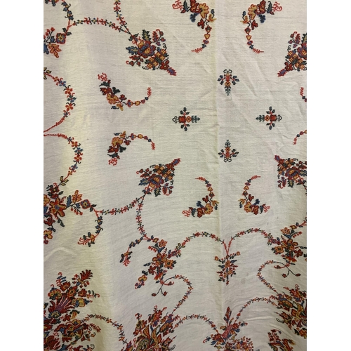 213 - A 19th century square woven shawl, Norwich, with deep borders, designed with flowers in urns to the ... 