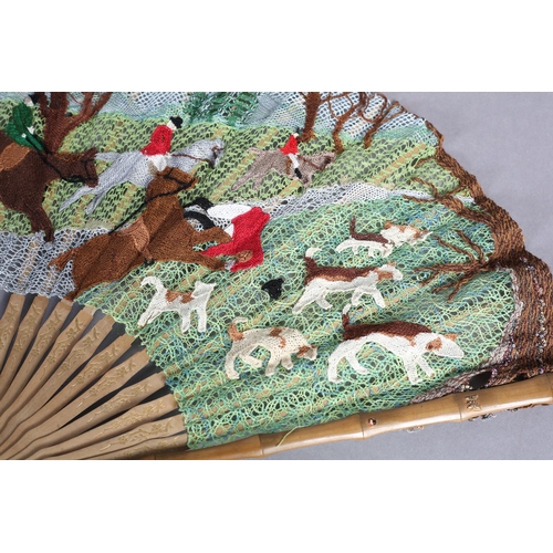 89 - Ann Collier: The Hunt, a large bobbin and needle lace fan mounted on pale wood, the guards, in bambo... 