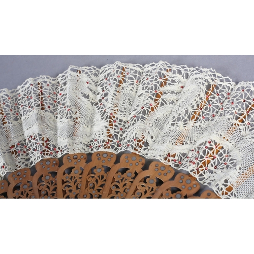 94 - Ann Collier: A cream bobbin lace leaf featuring two stylized dragons facing the flaming pearl, the l... 