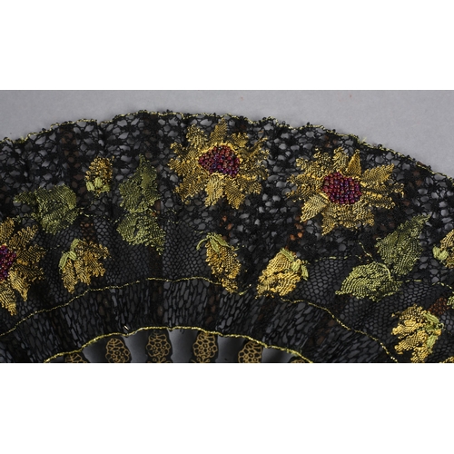 96 - Ann Collier: The Sunflowers, a bobbin lace leaf with black ground edged in gold, complementing the g... 