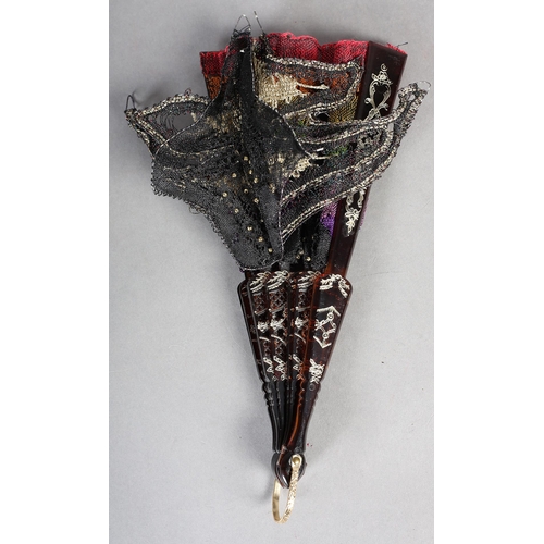 97 - Ann Collier: a 3-dimensional flower worked in bobbin lace in black and gold threads, scattered with ... 