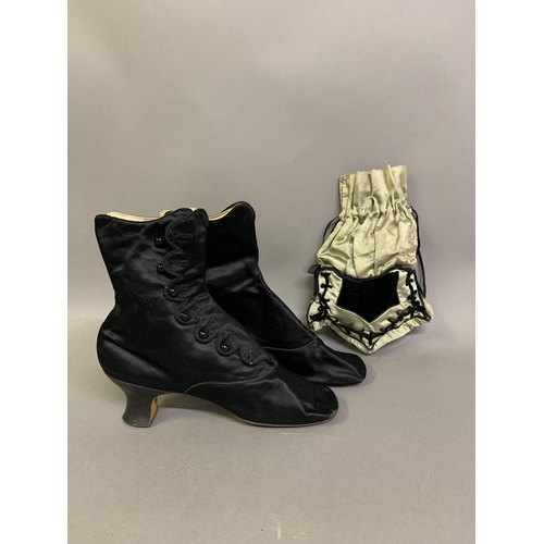 232 - 19th century fashion accessories: a pair of black silk evening boots with side buttons, leather heel... 