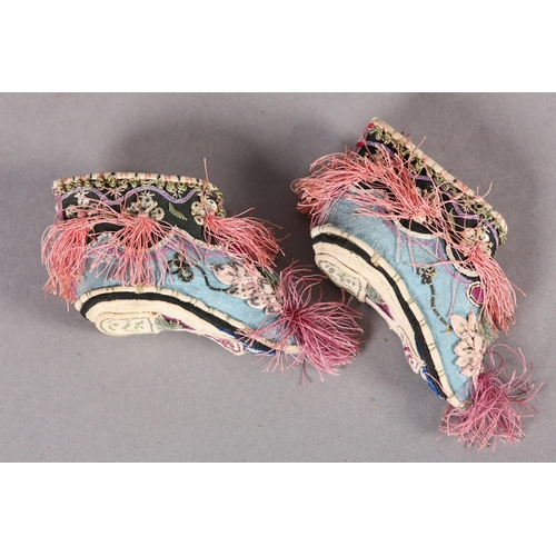 338 - Chinese embroidery, Qing Dynasty: A tiny pair of lotus shoes for bound feet, the lower section in tu... 