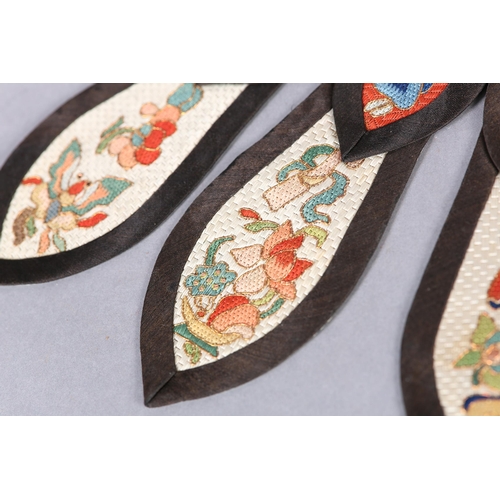 338 - Chinese embroidery, Qing Dynasty: A tiny pair of lotus shoes for bound feet, the lower section in tu... 