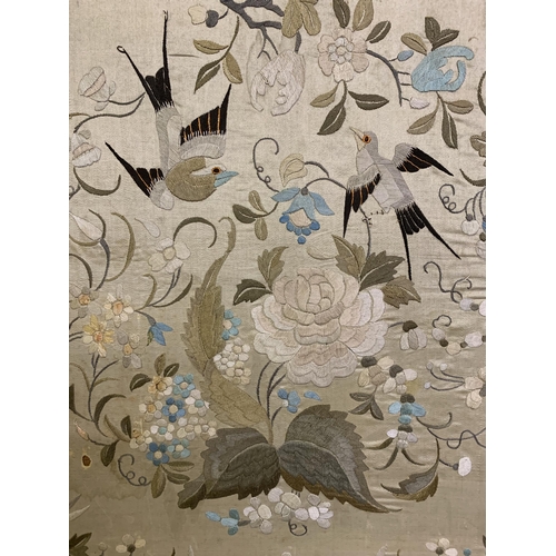 329 - A Chinese silk embroidered panel, Qing Dynasty, cream silk embroidered in pastels with darker shades... 