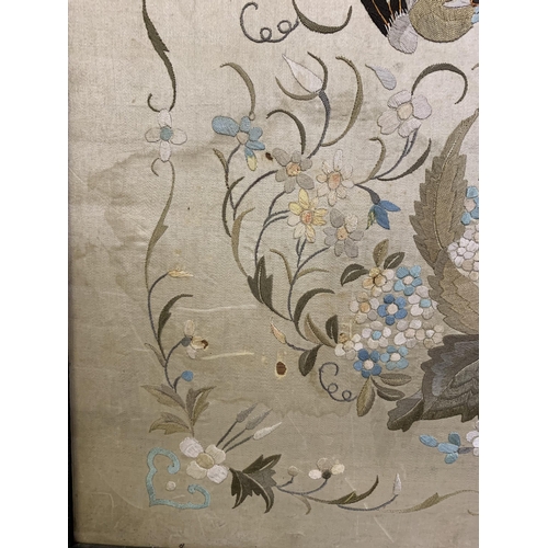 329 - A Chinese silk embroidered panel, Qing Dynasty, cream silk embroidered in pastels with darker shades... 