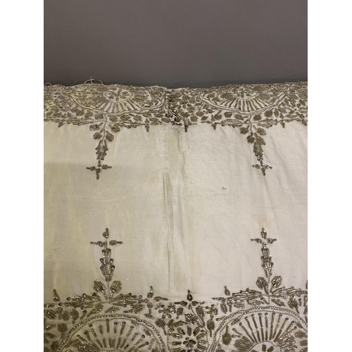 291 - A large, rectangular, ottoman silk satin cushion ornately embroidered in silver wire, 19th/20th cent... 