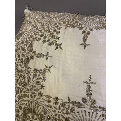 291 - A large, rectangular, ottoman silk satin cushion ornately embroidered in silver wire, 19th/20th cent... 