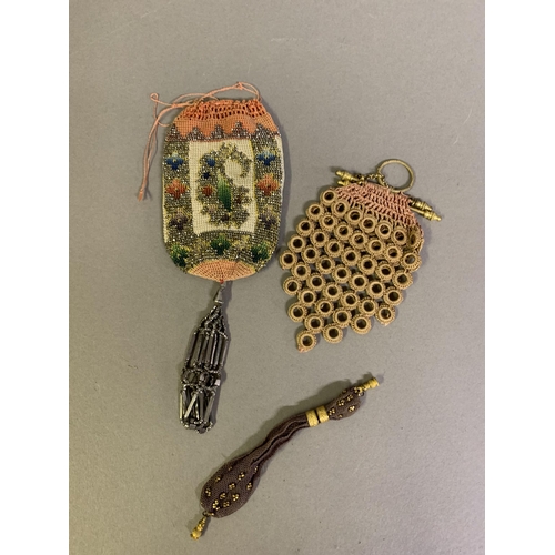 230 - Five 19th century purses and bags: the first, a miniature miser’s purse, quite tiny, perhaps for a d... 