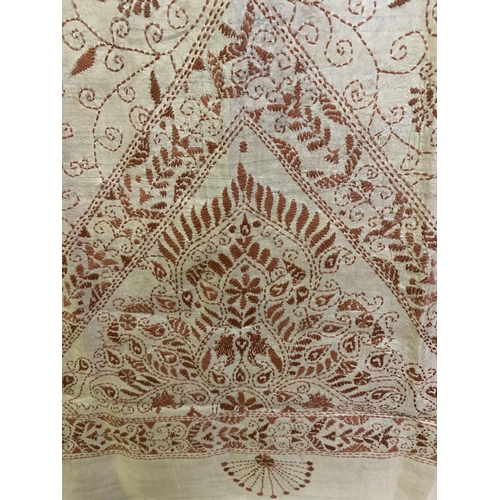 302 - A cream silk shawl embroidered in ginger, probably upper Bengal, the deep end panels with a bold tri... 