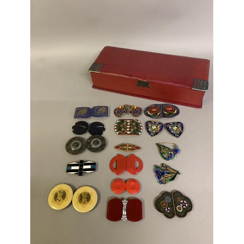 266 - A good selection of enamel belt buckles: the first, most unusual, dark green with almost millefiori ... 