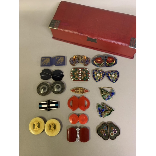 266 - A good selection of enamel belt buckles: the first, most unusual, dark green with almost millefiori ... 