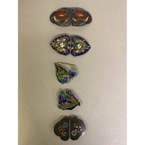 266 - A good selection of enamel belt buckles: the first, most unusual, dark green with almost millefiori ... 