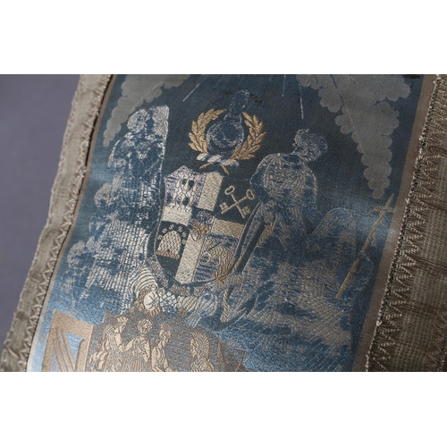 210 - A 19th century woven silk cushion, small, pale turquoise and gold,  bearing the symbols and blazon o... 