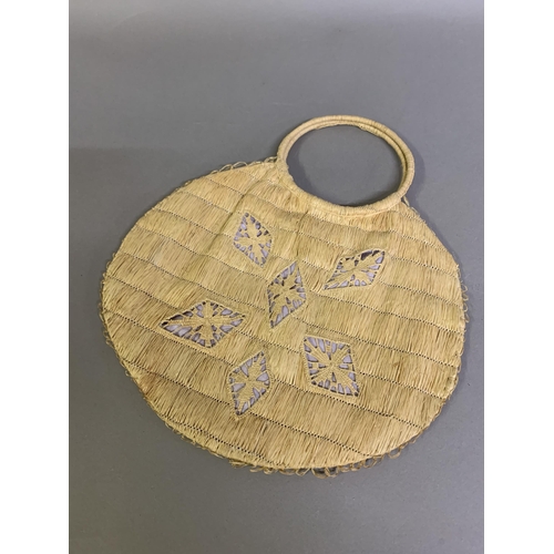 241B - An unusual natural straw bag with decorative panels working in the fashion of handmade lace, the out... 