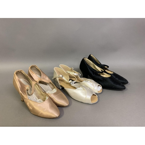 277 - Three pairs of satin shoes, the first in pale pink with ankle straps fastening with buttons, made in... 