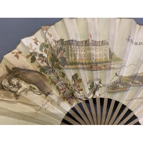 119 - A large late 19th century wood fan by Buissot Eventails Paris, the double paper leaf printed to the ... 