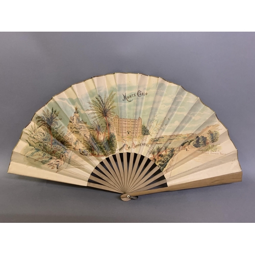 119 - A large late 19th century wood fan by Buissot Eventails Paris, the double paper leaf printed to the ... 