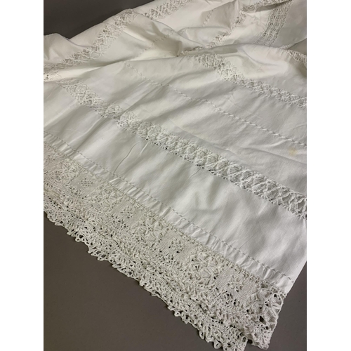 185 - Four white covers or tablecloths with extensive drawn-thread work: the first with a crochet border, ... 