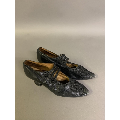 254 - A good pair of early 20th century shoes c 1910 – 1910, black leather, a three-section bar strap with... 