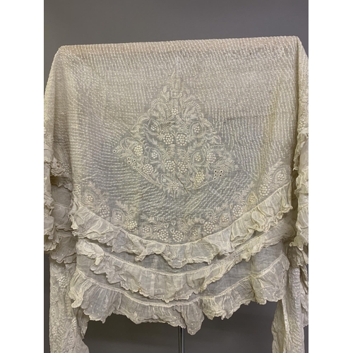 223 - Antique Whitework: a very large whitework cape,  19th century, fine spotted cotton, embroidered to a... 