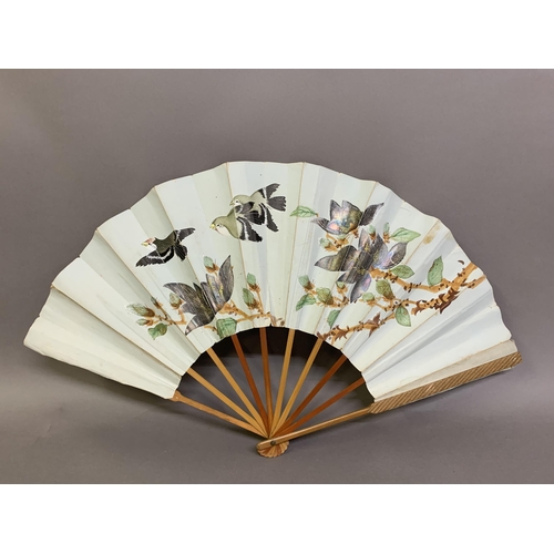 136 - Japanese fans: A dramatic gold and navy blue horizontal striped paper fan with double leaf, design r... 