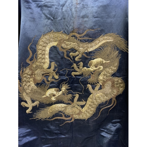 326 - A large Chinese silk hanging or cover, Qing Dynasty, the ground in deep blue silk, embroidered centr... 