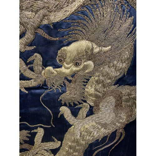 326 - A large Chinese silk hanging or cover, Qing Dynasty, the ground in deep blue silk, embroidered centr... 