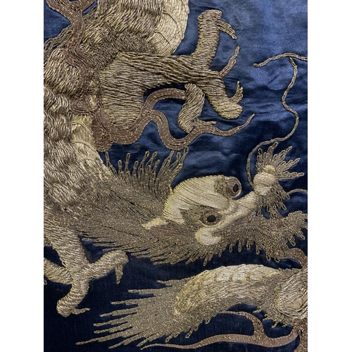 326 - A large Chinese silk hanging or cover, Qing Dynasty, the ground in deep blue silk, embroidered centr... 