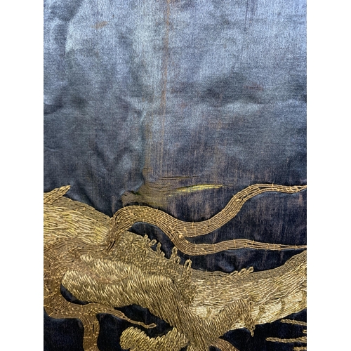 326 - A large Chinese silk hanging or cover, Qing Dynasty, the ground in deep blue silk, embroidered centr... 