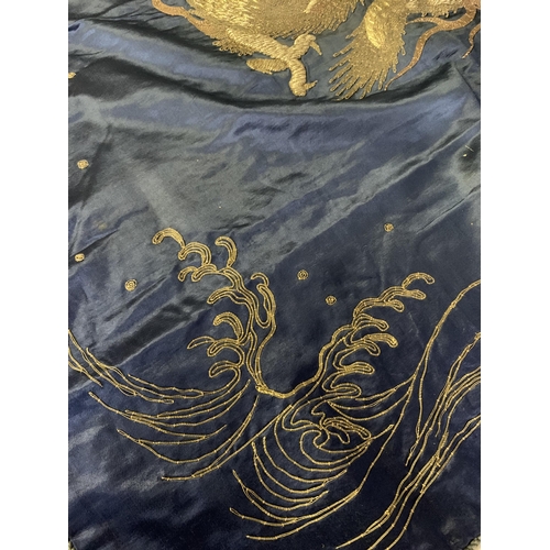 326 - A large Chinese silk hanging or cover, Qing Dynasty, the ground in deep blue silk, embroidered centr... 