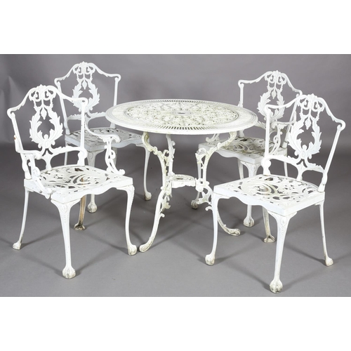 A white metal garden table and four chairs including two single chairs and two open armchairs, the t