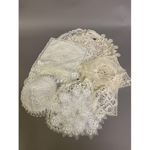 203 - A selection of lace mats, early 20th century and earlier, mainly handmade, some in sets, to include ... 