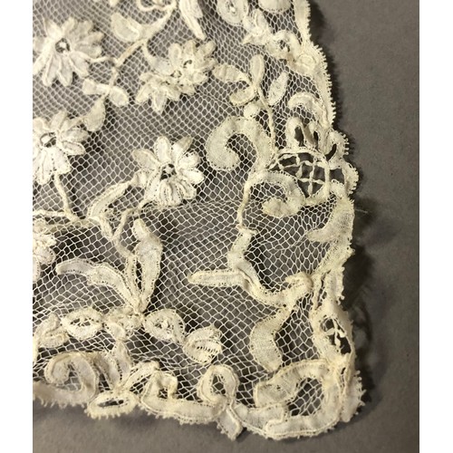 185B - A Honiton bobbin appliqué rectangular wedding veil, 1880’s – 1900, approx. 210cm by 190cm, with flor... 