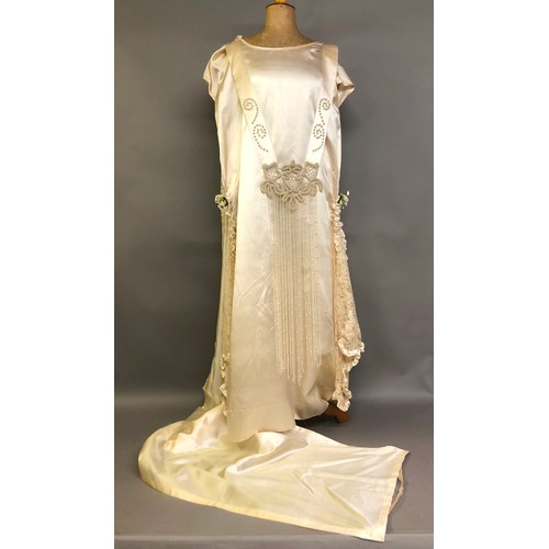 270 - C1920’s ivory silk wedding dress with train, the latter attached from the back of the neck, attracti... 