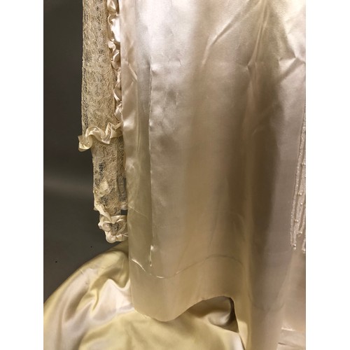 270 - C1920’s ivory silk wedding dress with train, the latter attached from the back of the neck, attracti... 