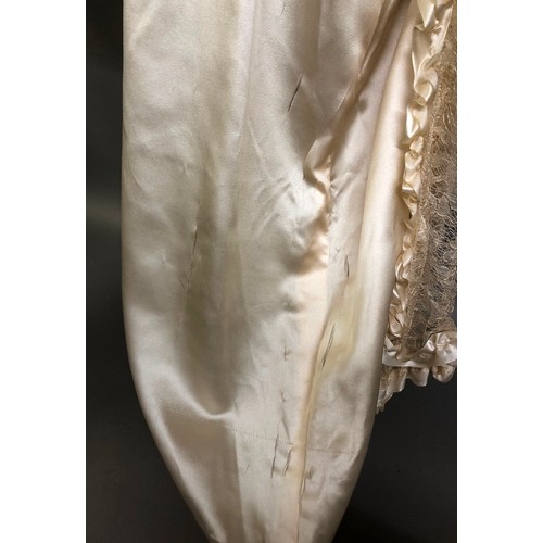 270 - C1920’s ivory silk wedding dress with train, the latter attached from the back of the neck, attracti... 