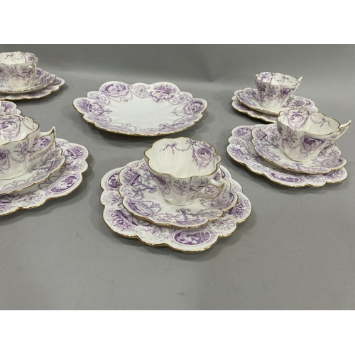 20 - A late 19th century Foley china tea service printed in mauve with classical design of figures in ova... 