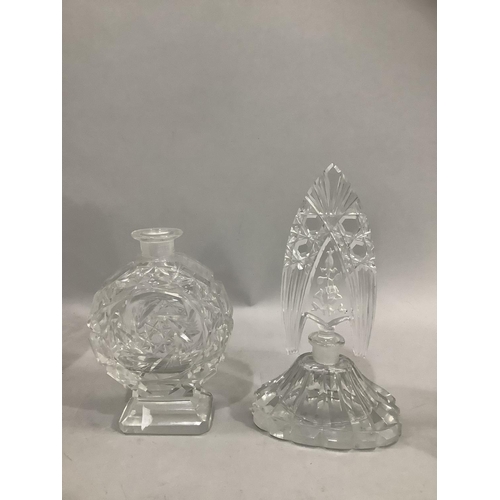 333 - A cut glass flower vase, a wedge shaped decanter and two Lalique style perfume bottles