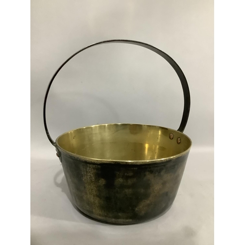 186 - A brass preserve pan with iron hoop handle, 26.5cm diameter