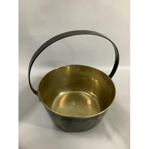 186 - A brass preserve pan with iron hoop handle, 26.5cm diameter